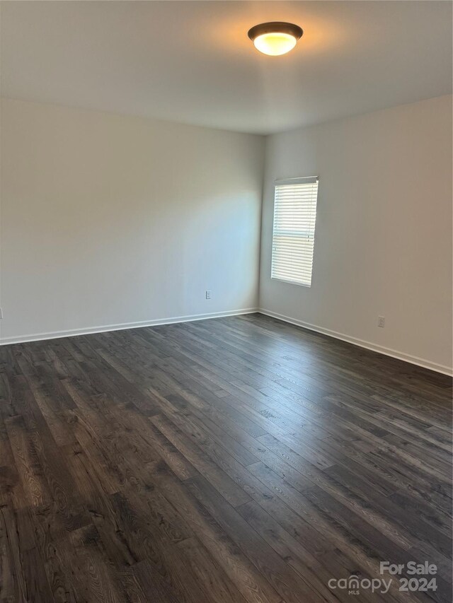 empty room featuring dark hardwood / wood-style floors