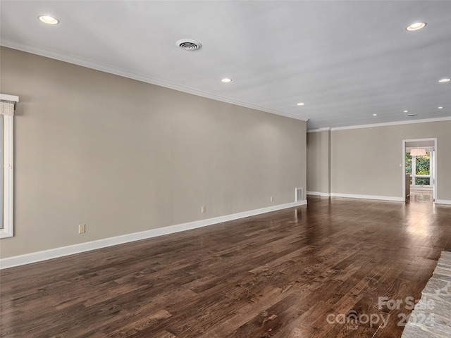 unfurnished room featuring crown molding and dark hardwood / wood-style floors