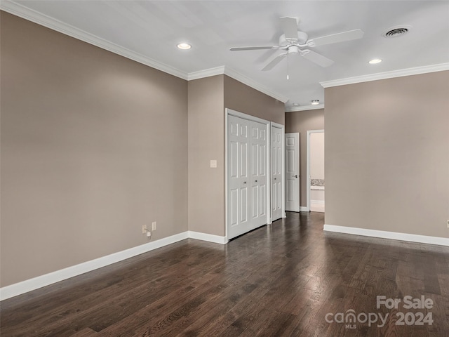 spare room featuring ceiling fan, crown molding, and dark hardwood / wood-style floors