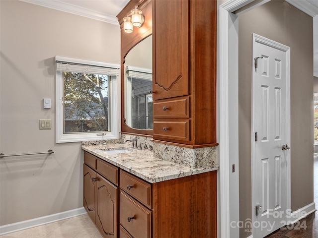 bathroom with vanity and crown molding