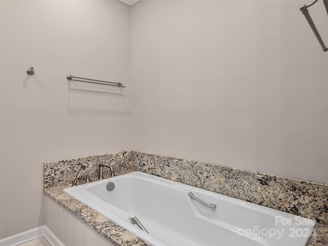 bathroom featuring a tub to relax in