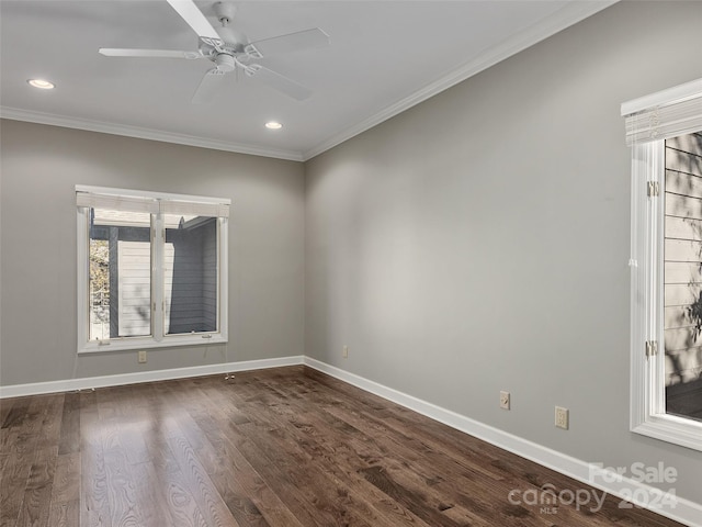 unfurnished room with crown molding, ceiling fan, and dark hardwood / wood-style flooring