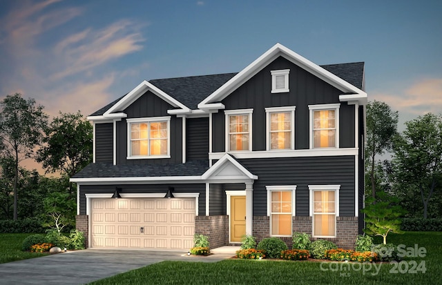 craftsman house featuring board and batten siding, brick siding, an attached garage, and concrete driveway