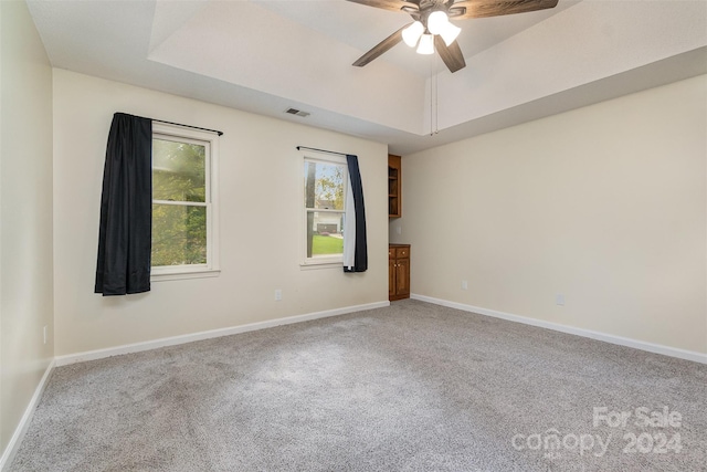 empty room with carpet and ceiling fan