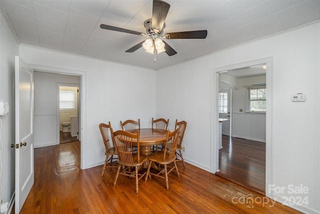 dining room with hardwood / wood-style flooring and ceiling fan