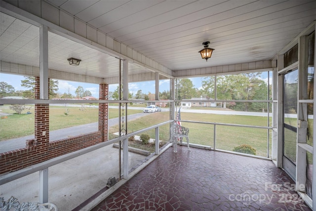 unfurnished sunroom featuring plenty of natural light