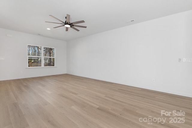 unfurnished room with ceiling fan and light hardwood / wood-style floors