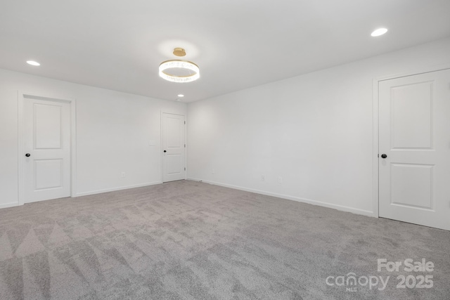 unfurnished room featuring carpet flooring