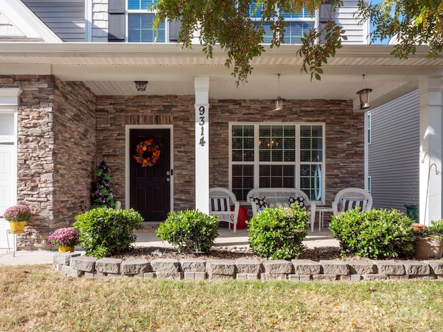 entrance to property featuring covered porch