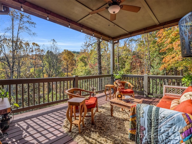 wooden deck featuring ceiling fan