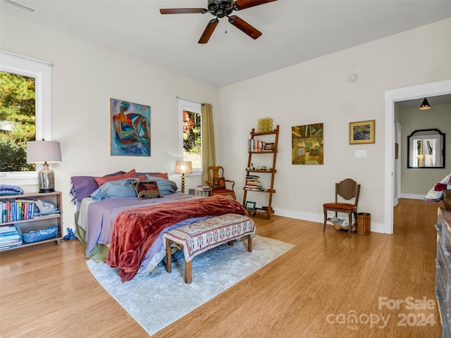 bedroom featuring light hardwood / wood-style floors and ceiling fan