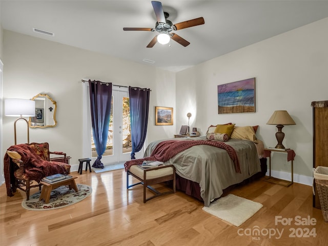 bedroom with light hardwood / wood-style flooring, access to exterior, and ceiling fan