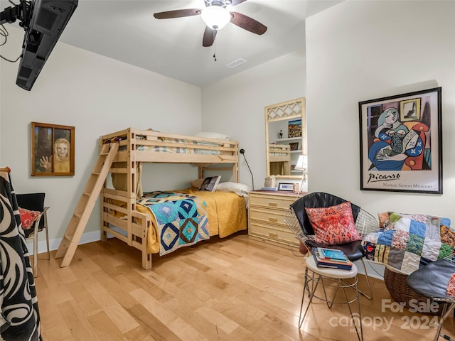 bedroom with light hardwood / wood-style flooring and ceiling fan