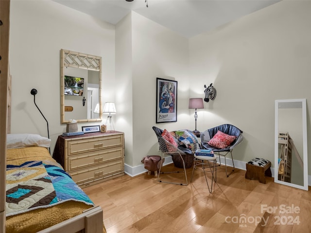 bedroom with light hardwood / wood-style floors