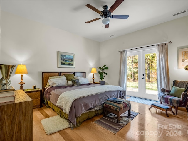 bedroom featuring french doors, ceiling fan, light hardwood / wood-style floors, and access to exterior