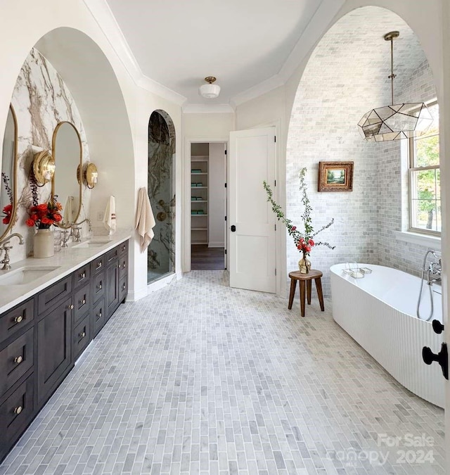 bathroom featuring vanity, a tub, and ornamental molding