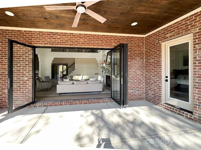 view of patio featuring ceiling fan