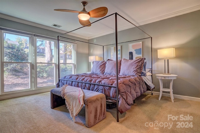 bedroom with ornamental molding, carpet floors, and ceiling fan