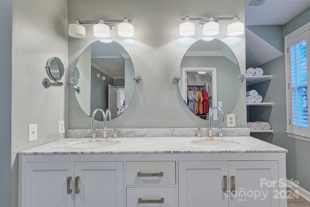 bathroom featuring vanity and crown molding