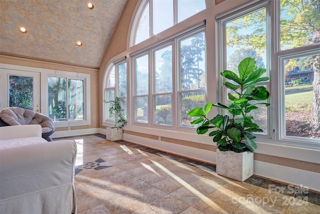 sunroom / solarium with lofted ceiling and plenty of natural light