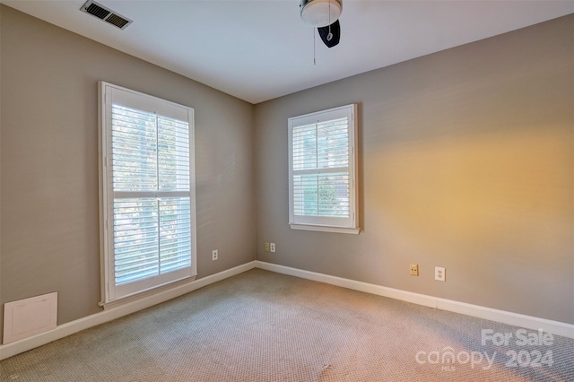 unfurnished room featuring carpet floors