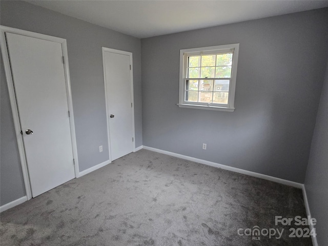 unfurnished bedroom with carpet