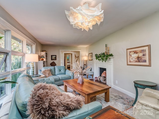 living room with a brick fireplace