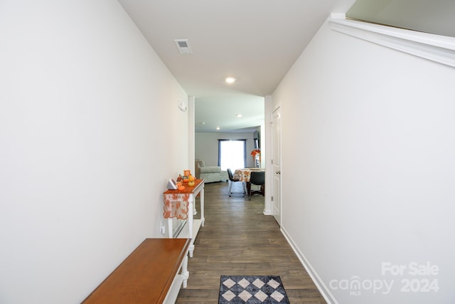 corridor with dark hardwood / wood-style floors