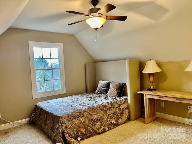 bedroom featuring ceiling fan, light colored carpet, and lofted ceiling