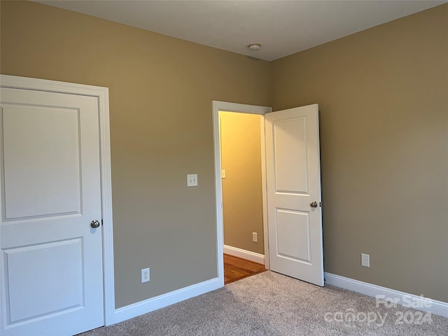 unfurnished bedroom with carpet