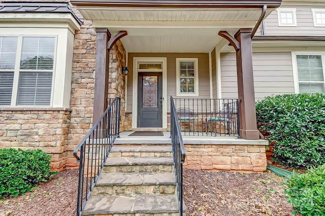 property entrance featuring a porch