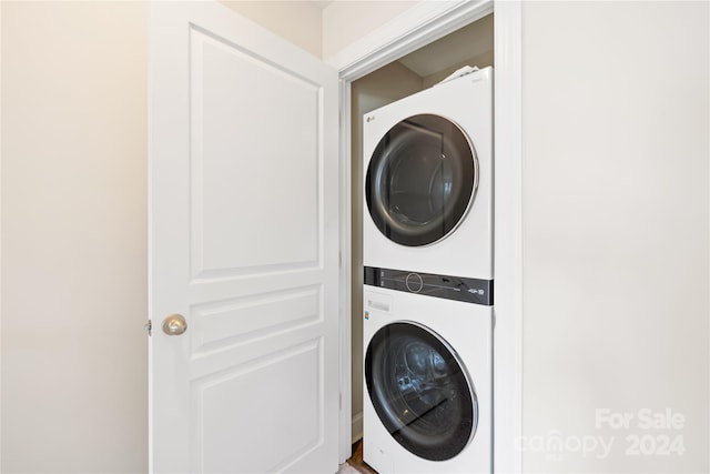 laundry area featuring stacked washer and clothes dryer