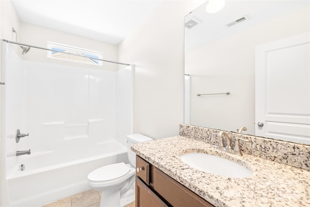 full bathroom with vanity, washtub / shower combination, toilet, and tile patterned flooring