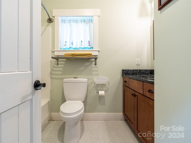 full bathroom featuring toilet, shower / washtub combination, vanity, and tile patterned flooring