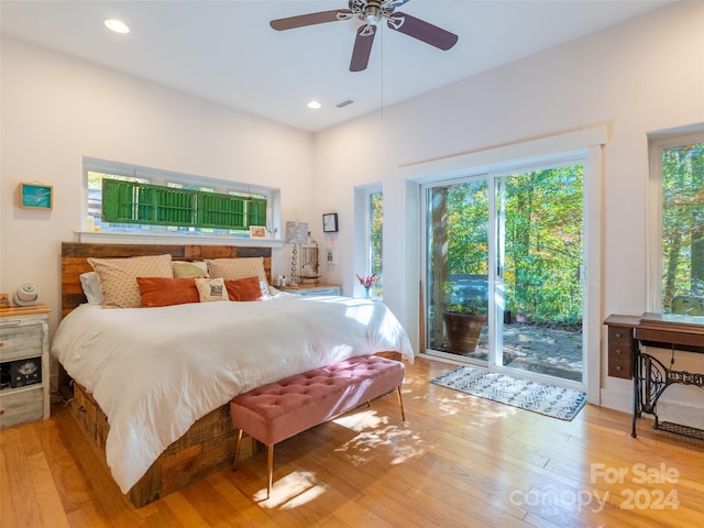 bedroom with access to exterior, light hardwood / wood-style floors, and ceiling fan