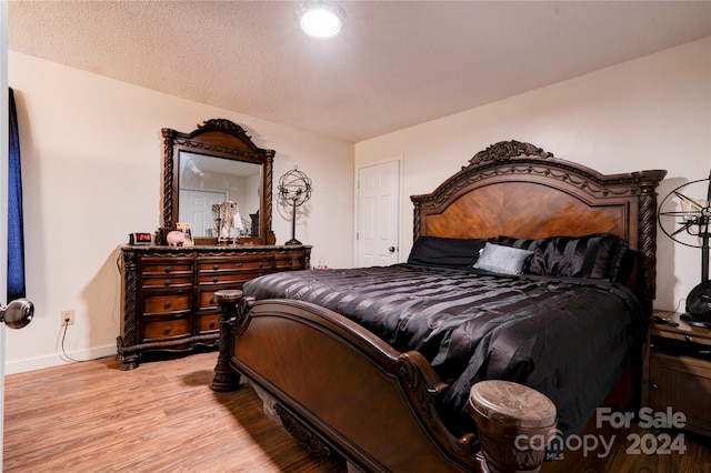 bedroom with light hardwood / wood-style flooring