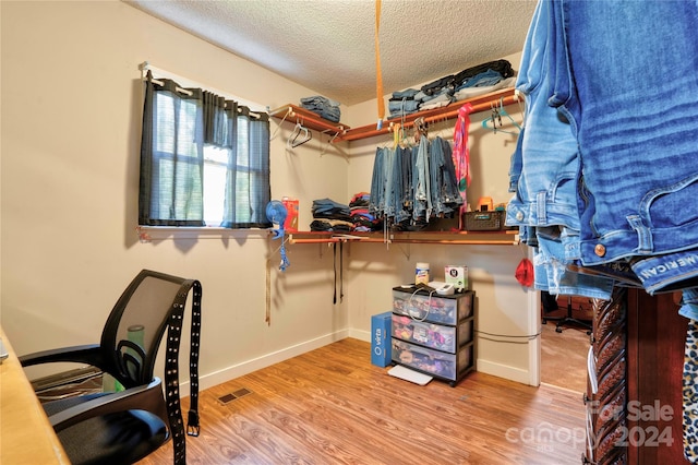 office space featuring a textured ceiling and hardwood / wood-style flooring