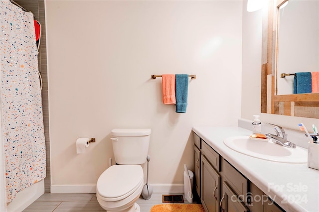 full bathroom with toilet, shower / tub combo, and vanity