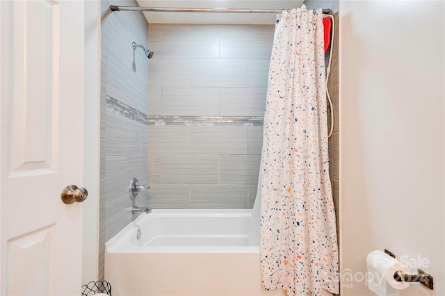 bathroom with shower / bathtub combination with curtain