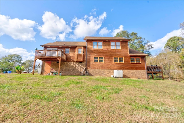 back of property with a lawn, a wooden deck, and cooling unit