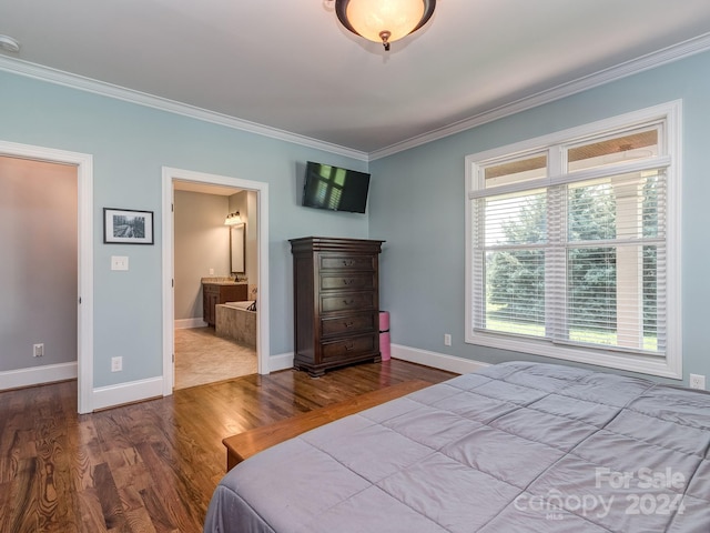 bedroom featuring connected bathroom, hardwood / wood-style floors, and crown molding