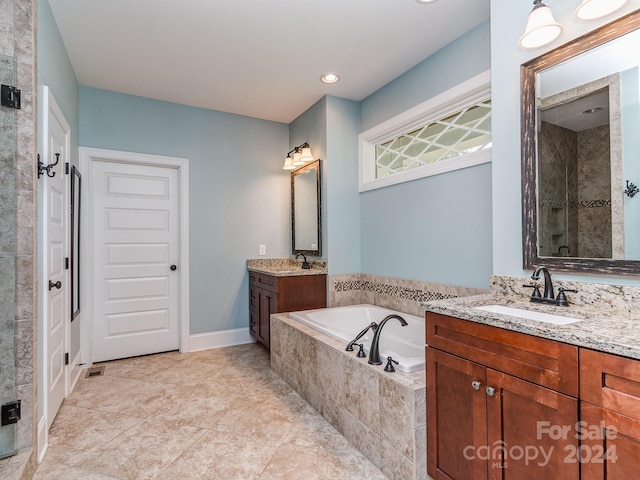 bathroom with vanity, shower with separate bathtub, and tile patterned flooring