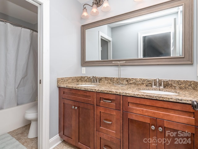 full bathroom featuring vanity, shower / tub combo with curtain, toilet, and tile patterned flooring