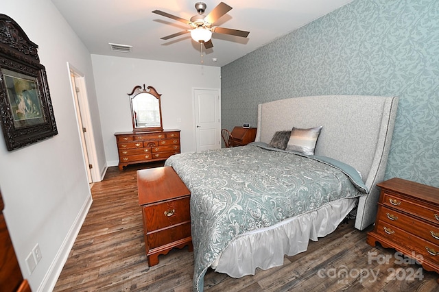 bedroom with dark wood-type flooring and ceiling fan