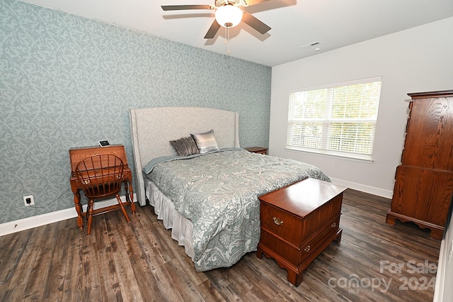 bedroom featuring ceiling fan and dark hardwood / wood-style flooring