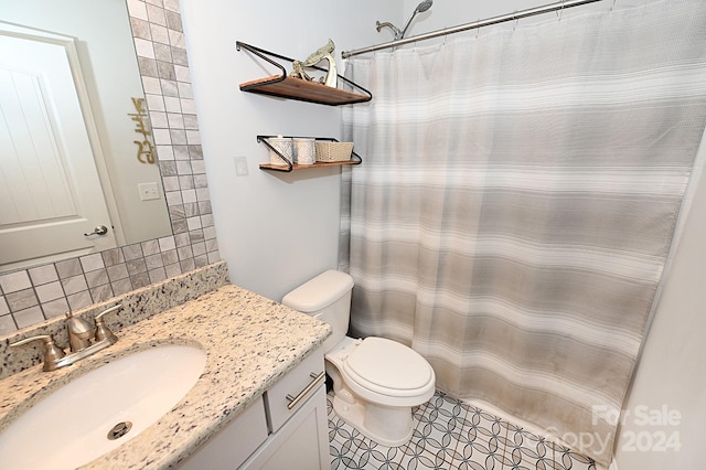 bathroom with a shower with shower curtain, toilet, tile patterned floors, vanity, and decorative backsplash