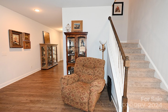 stairway with hardwood / wood-style flooring