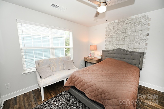 bedroom featuring dark wood-type flooring and ceiling fan