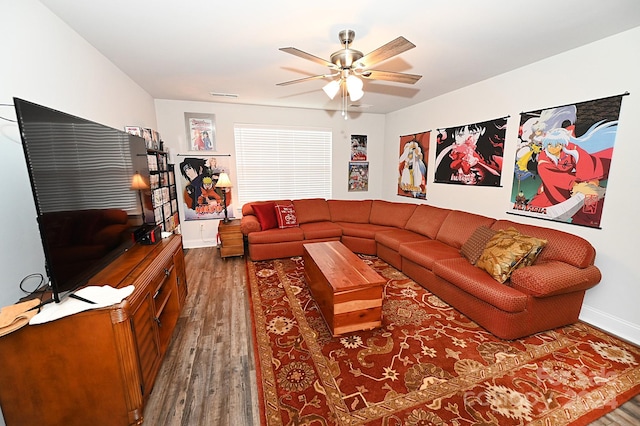 living room featuring ceiling fan and hardwood / wood-style flooring