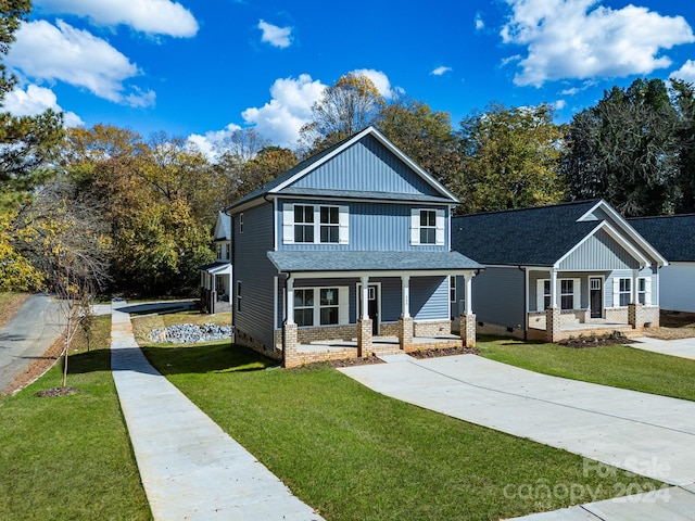 view of front of property with a front yard and a porch